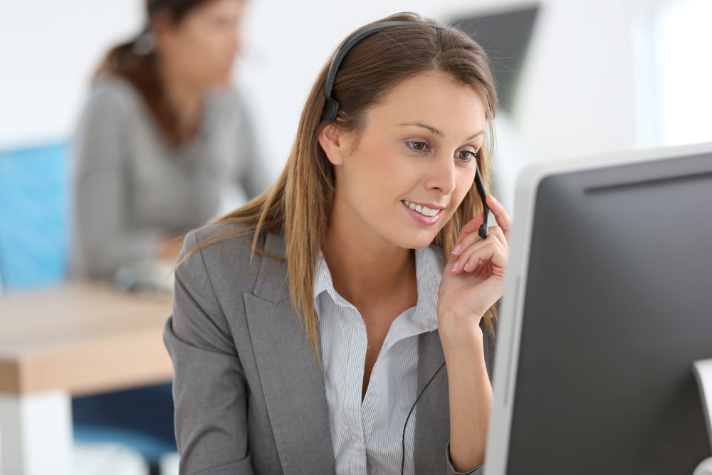 Smiling customer service representative at work Smiling customer service representative at work